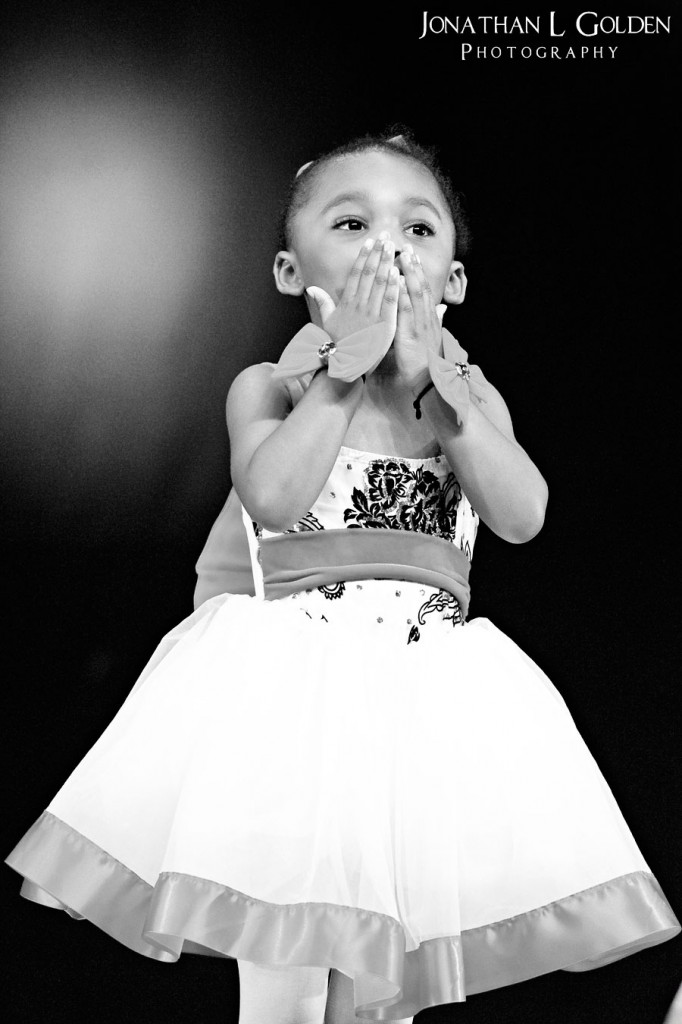 ava-recital-on-stage-blowing-kisses-b&w ava-recital-on-stage-blowing-kisses-b&w